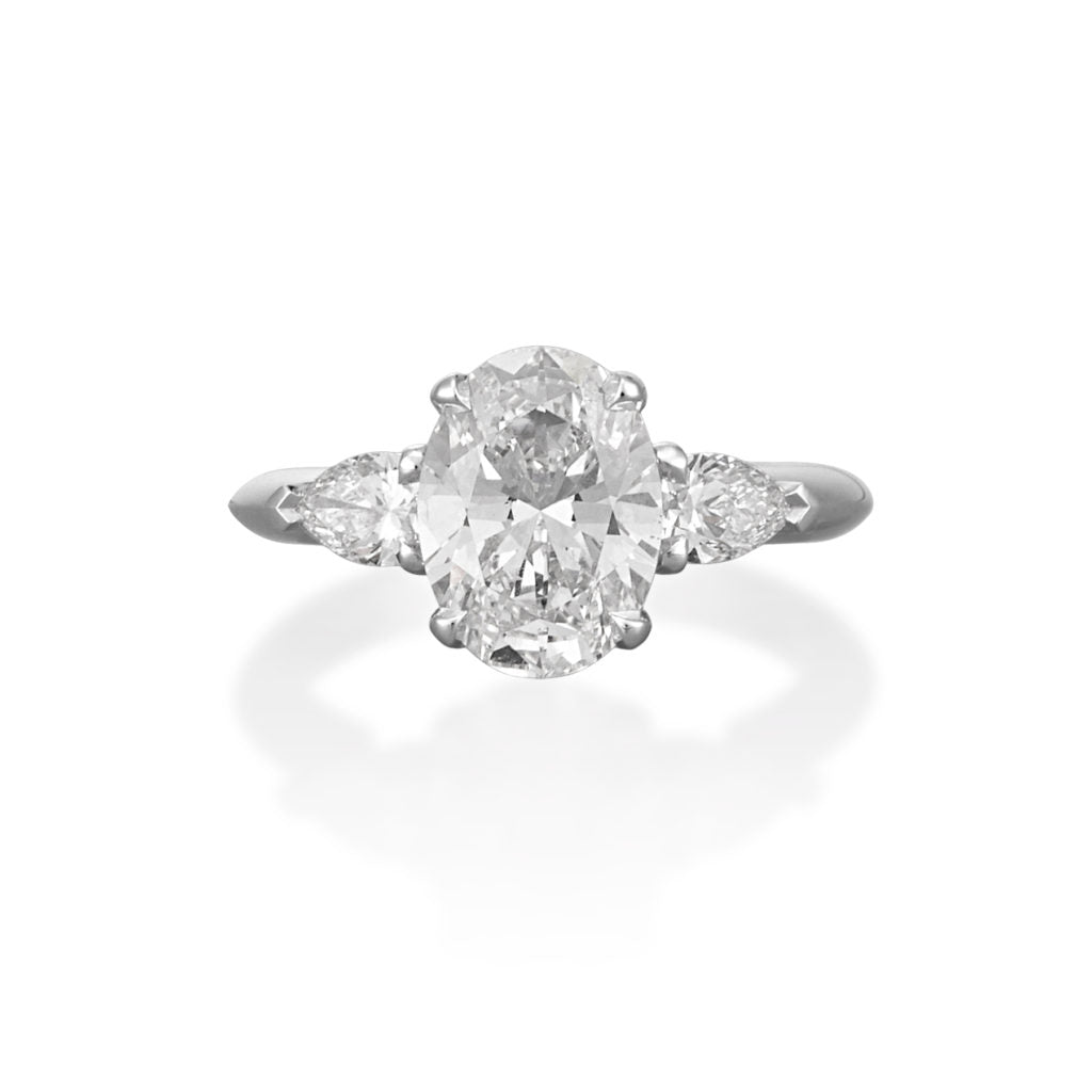 THREE STONE OVAL AND PEAR DIAMOND ENGAGEMENT RING