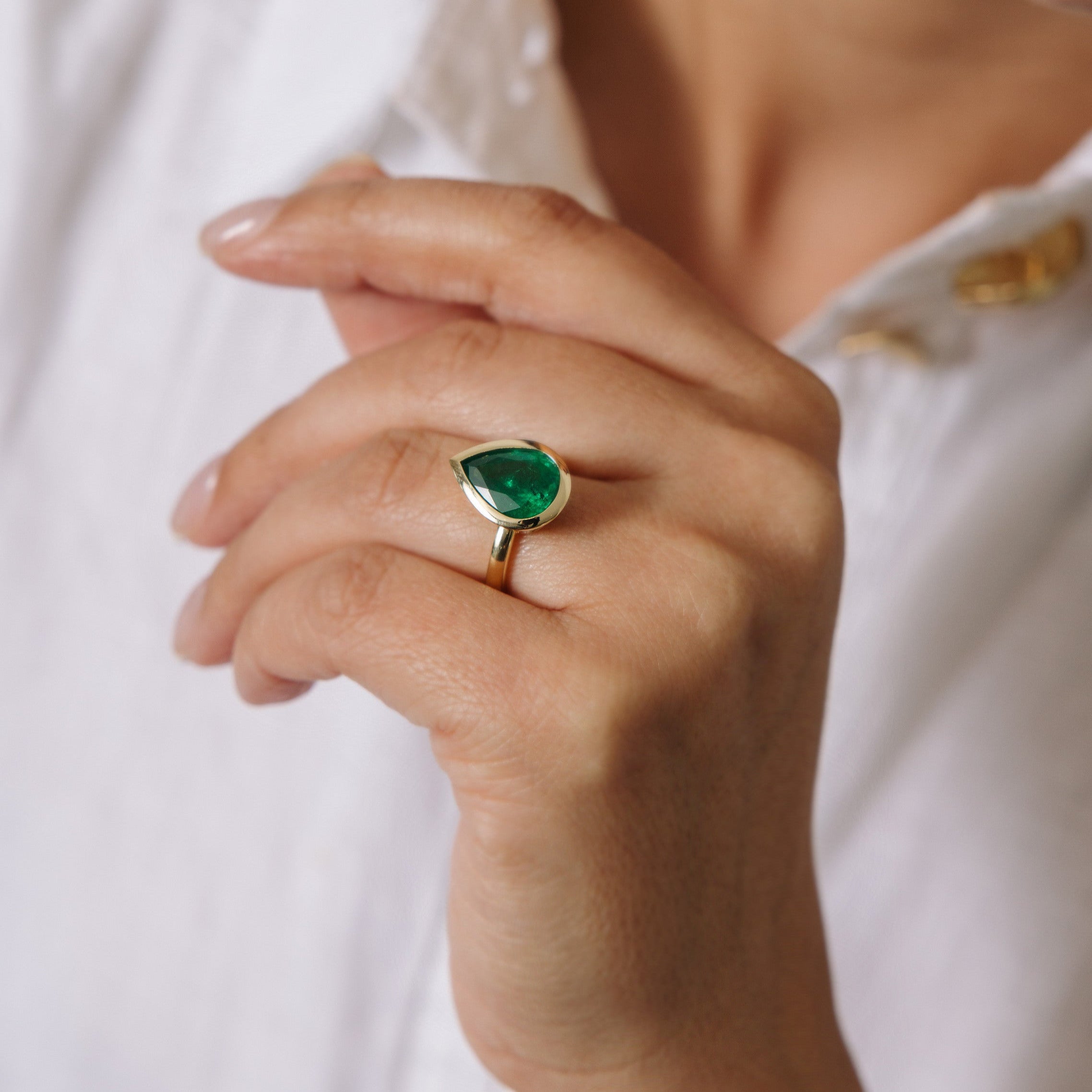 PEAR SHAPED ZAMBIAN EMERALD BEZEL SET RING