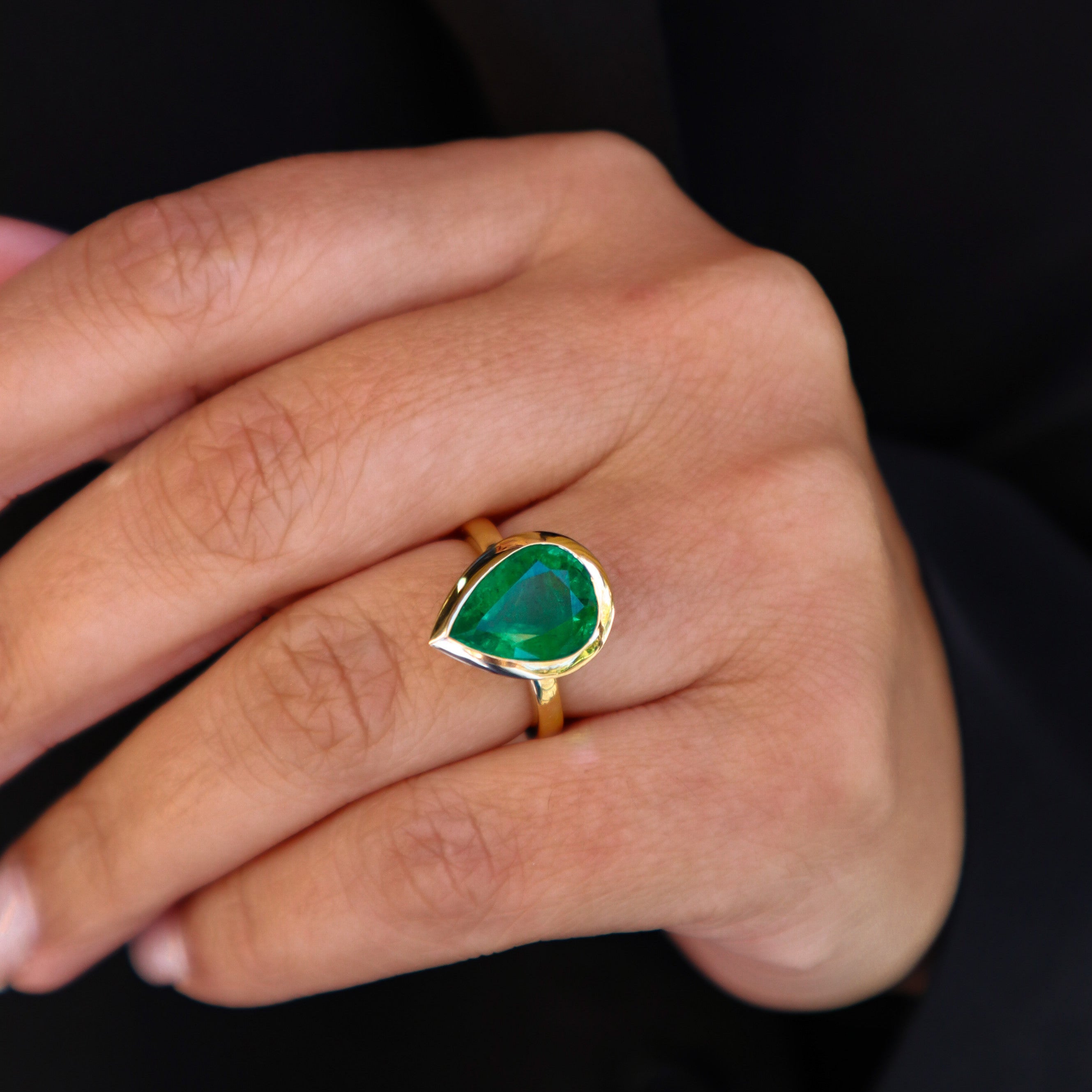 PEAR SHAPED ZAMBIAN EMERALD BEZEL SET RING