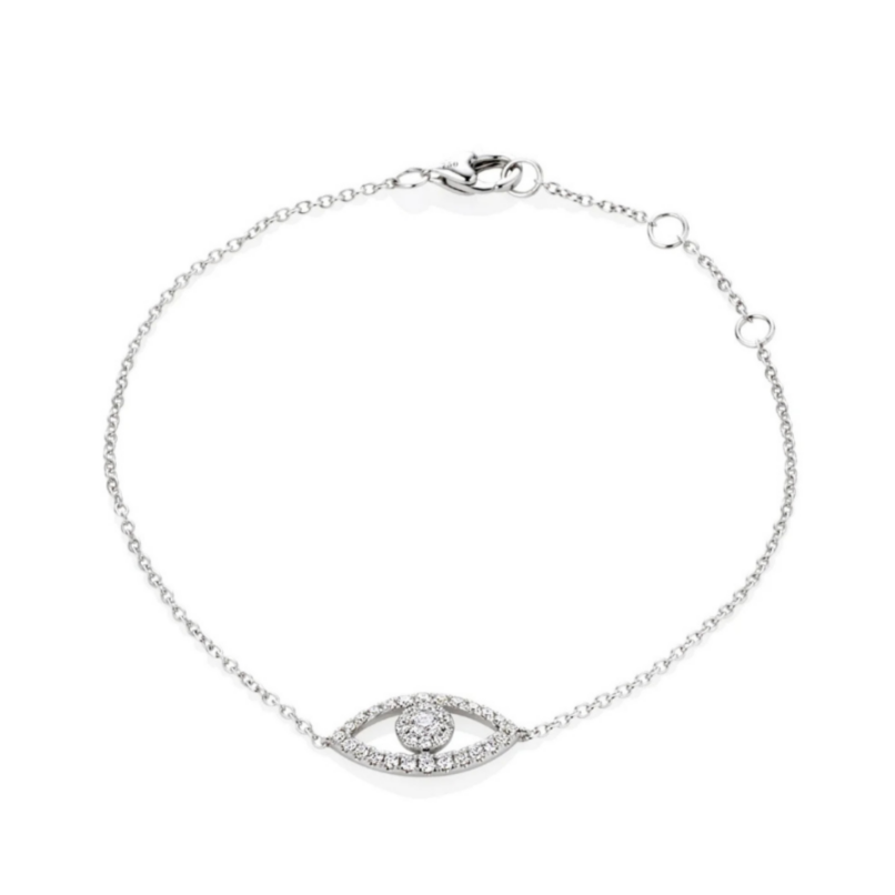 A white gold bracelet with a diamond-set eye design in the center, featuring a fine chain.