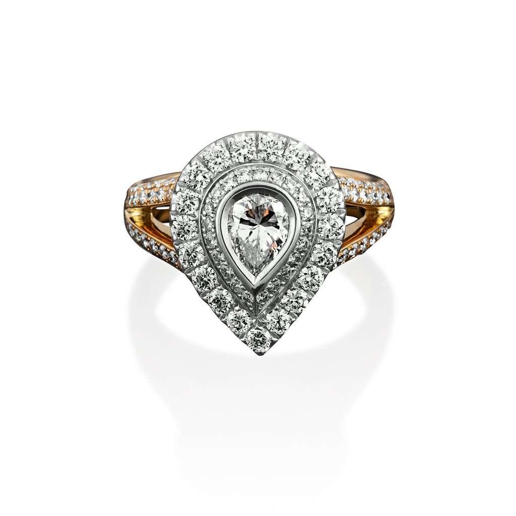 PEAR DIAMOND RING WITH GRADUATING DIAMOND HALO