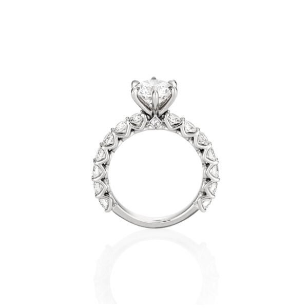 ROUND BRILLIANT DIAMOND SHARED CLAW ENGAGEMENT RING
