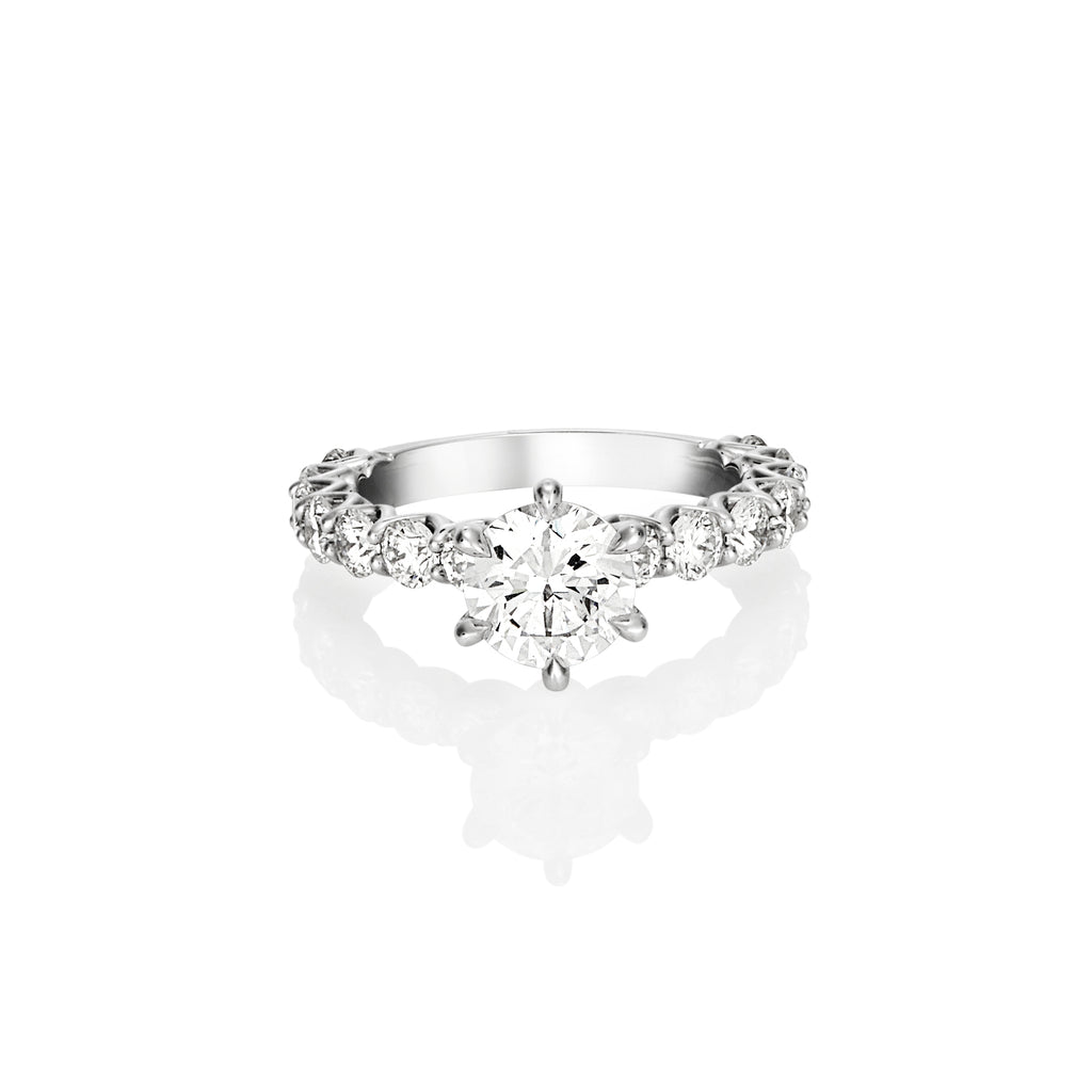 ROUND BRILLIANT DIAMOND SHARED CLAW ENGAGEMENT RING