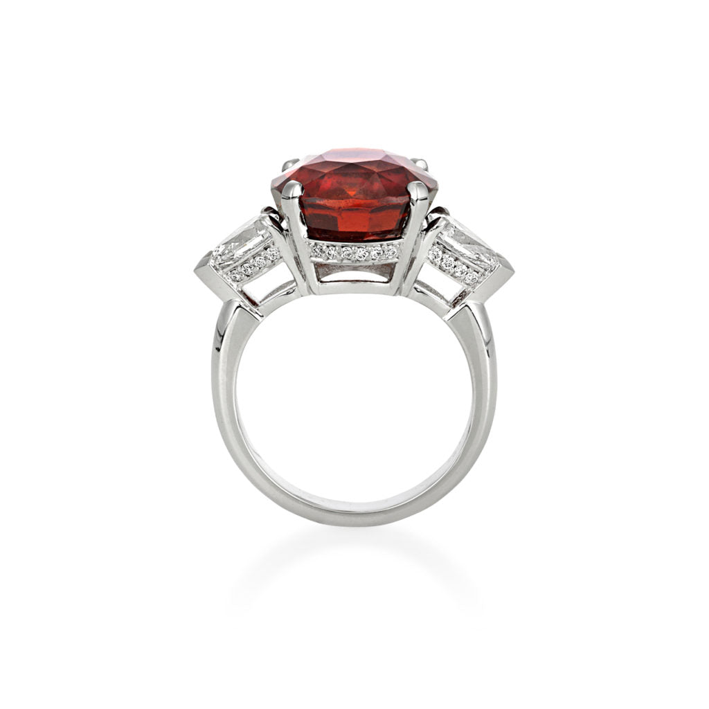 ROUND GARNET RING WITH TAPERED PEAR DIAMOND SHOULDERS